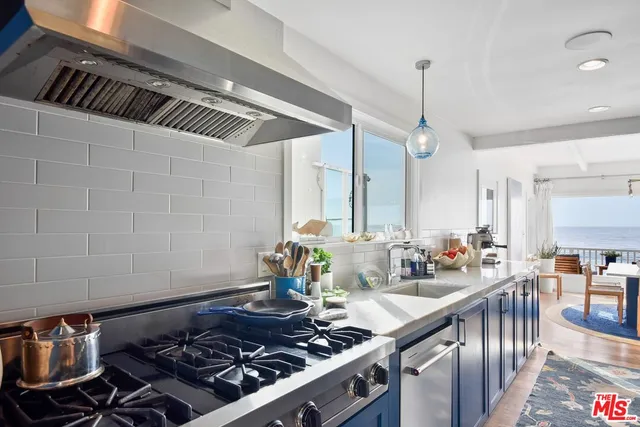 a kitchen with a stove and a table