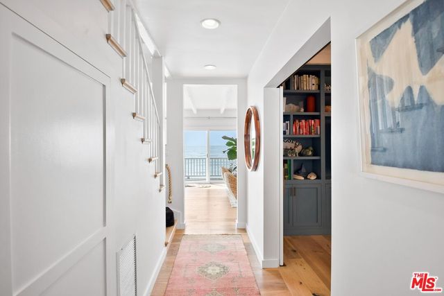 a view of a hallway with shelves