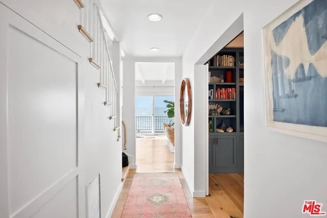 a view of a hallway with shelves