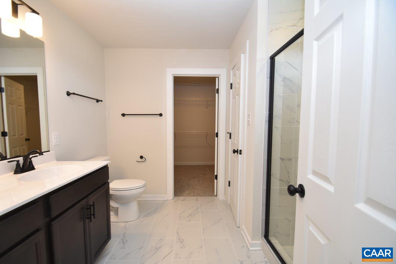 6 Sclaters Ford Road Palmyra, VA 22963 - Photo 29 of 33 a bathroom with a toilet a sink and a mirror