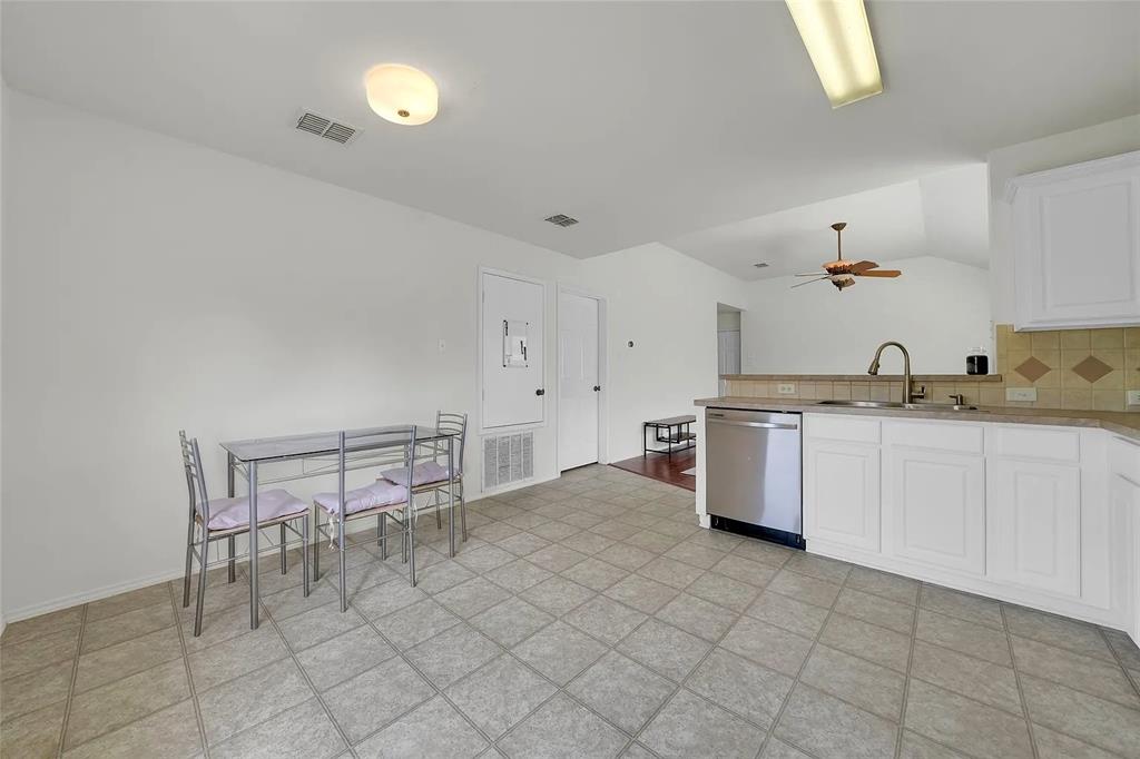 713 Baldwin Road Wylie, TX 75098 - Photo 11 of 29 a kitchen with a sink cabinets and window