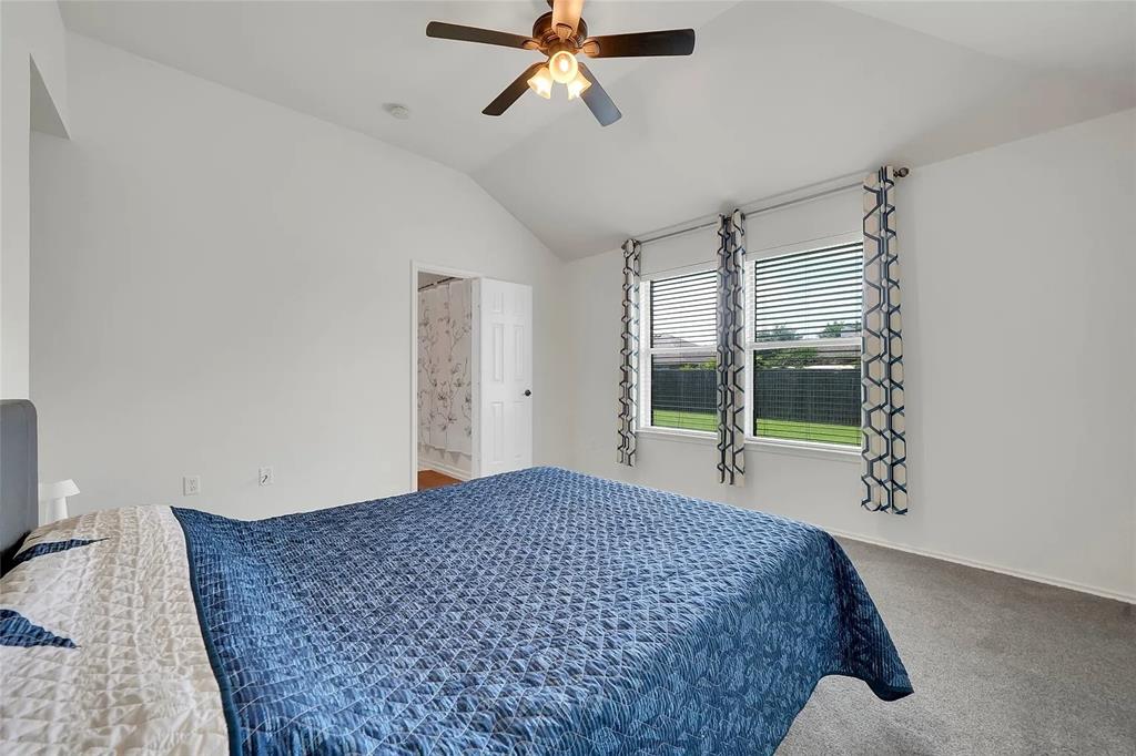 713 Baldwin Road Wylie, TX 75098 - Photo 12 of 29 a bedroom with a bed and a window