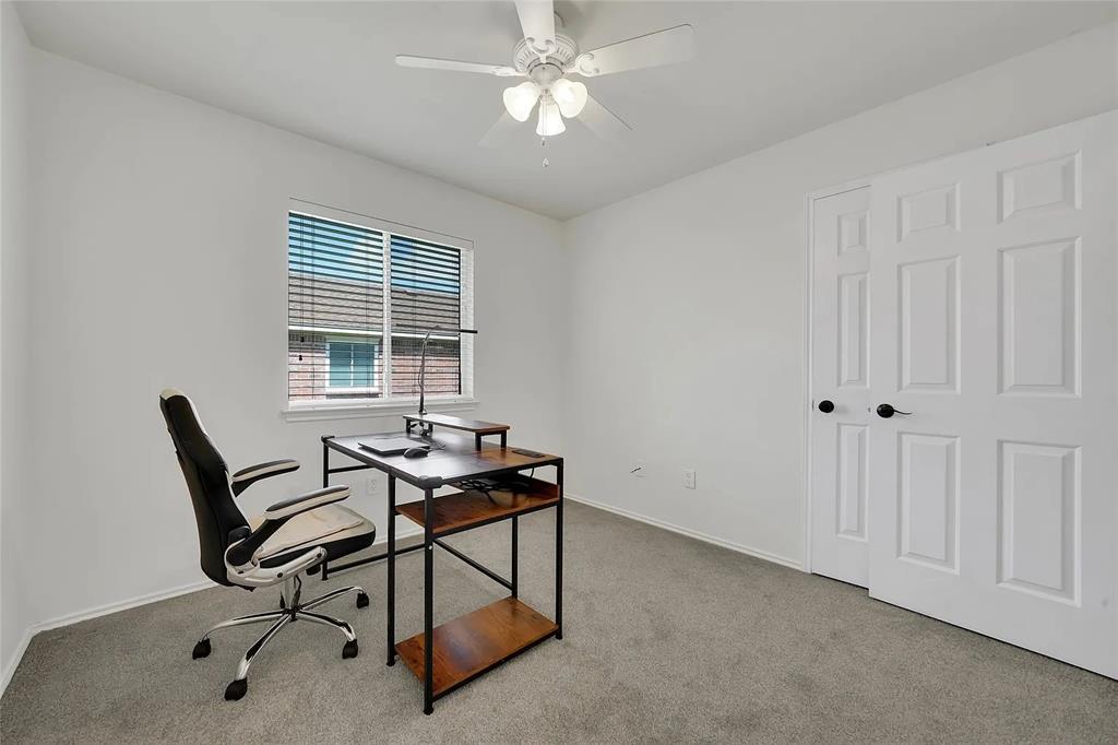 713 Baldwin Road Wylie, TX 75098 - Photo 16 of 29 a view of a workspace with furniture and a window