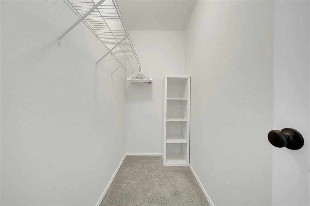 713 Baldwin Road Wylie, TX 75098 - Photo 19 of 29 a view of small space with racks on the wall