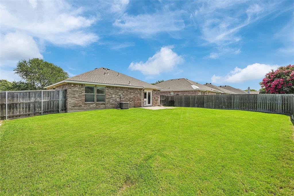 713 Baldwin Road Wylie, TX 75098 - Photo 22 of 29 a front view of a house with garden