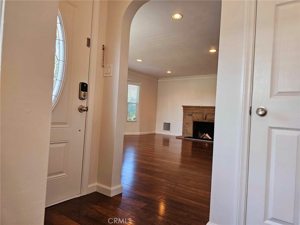 5259 Angeles Vista Boulevard View Park, CA 90043 - Photo 12 of 42 a view of empty room with wooden floor and fireplace
