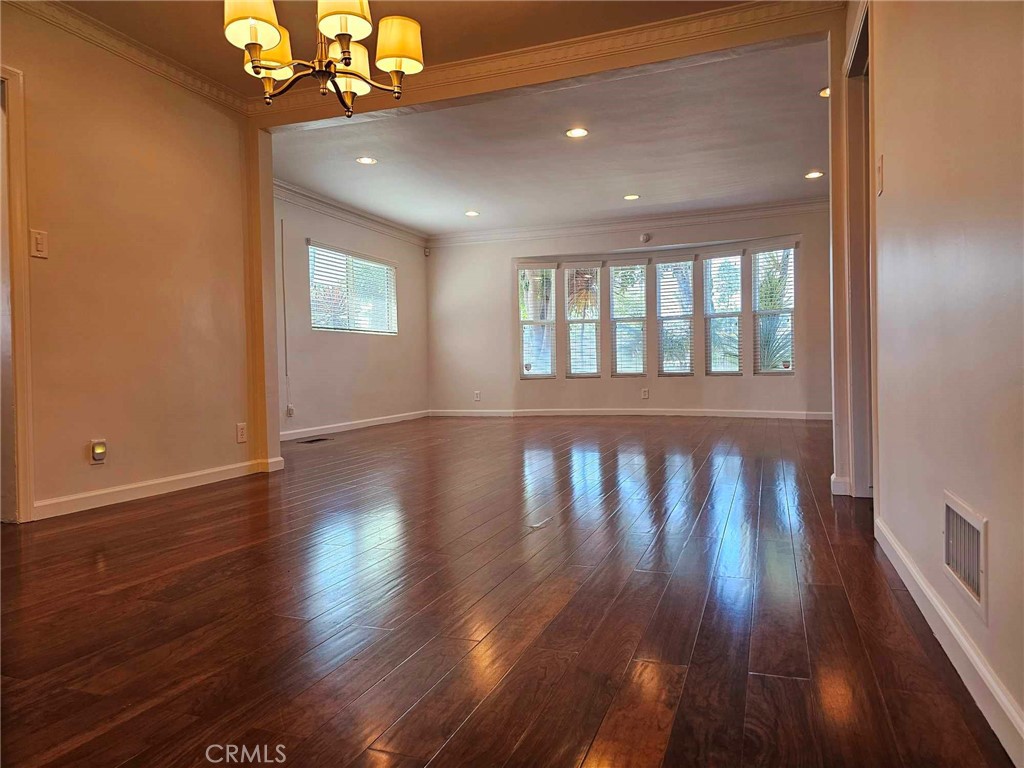 5259 Angeles Vista Boulevard View Park, CA 90043 - Photo 17 of 42 a view of wooden floor and chandelier in a room
