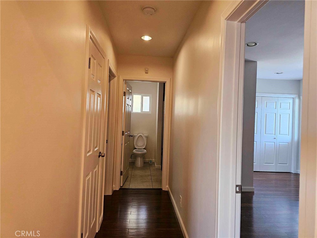 5259 Angeles Vista Boulevard View Park, CA 90043 - Photo 26 of 42 a view of a hallway with a wooden floor