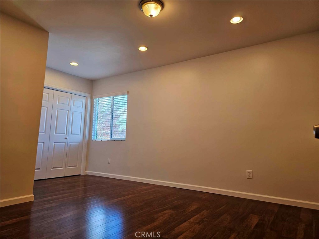 5259 Angeles Vista Boulevard View Park, CA 90043 - Photo 27 of 42 a view of an empty room with wooden floor and a window