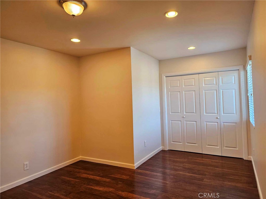 5259 Angeles Vista Boulevard View Park, CA 90043 - Photo 28 of 42 a view of an empty room with wooden floor