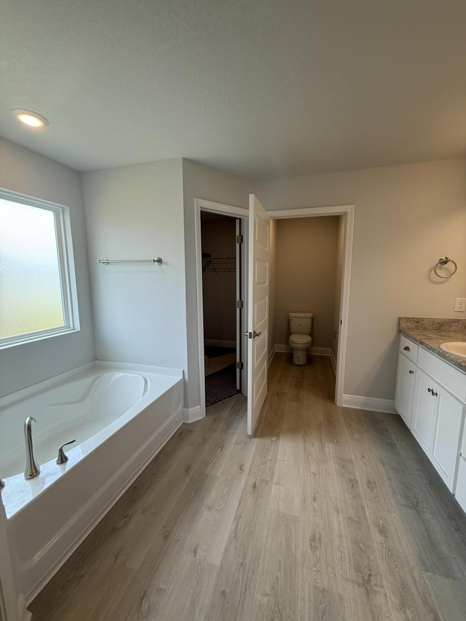 6002 Crocket Cove Crestview, FL 32539 - Photo 24 of 29 a bathroom with a sink and a bathtub