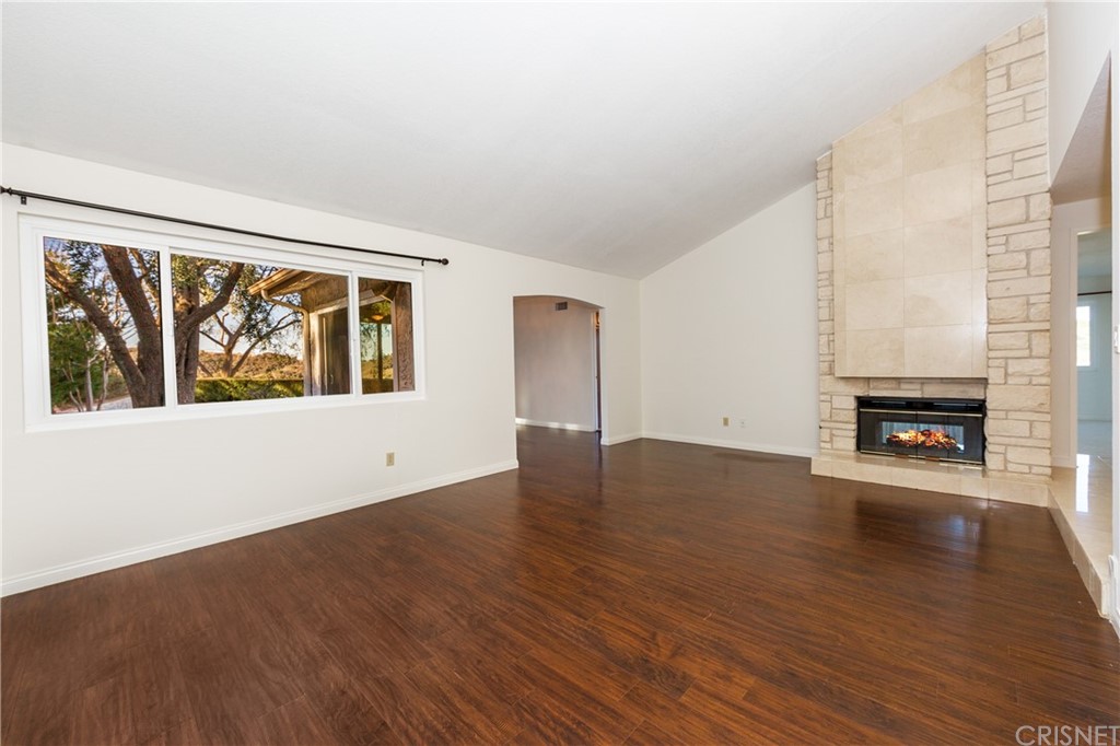 3117 Voltaire Drive Topanga, CA 90290 - Photo 3 of 14 wooden floor in an empty room with a window