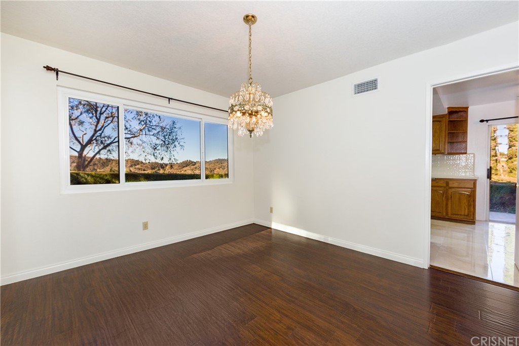 3117 Voltaire Drive Topanga, CA 90290 - Photo 4 of 14 a view of a room with wooden floor chandelier and windows
