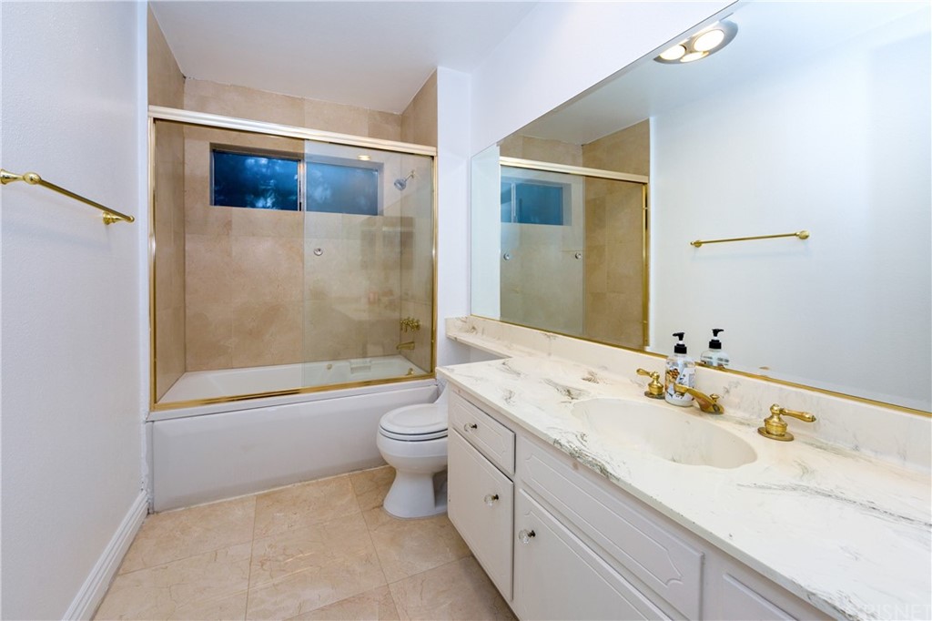 3117 Voltaire Drive Topanga, CA 90290 - Photo 10 of 14 a bathroom with a sink a toilet and shower