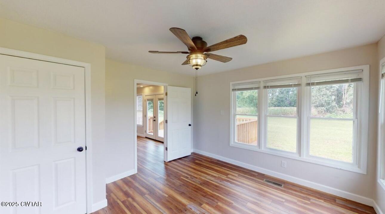 40 J D Barr Road Milan, TN 38358 - Photo 13 of 28 a view of an empty room with wooden floor and a window