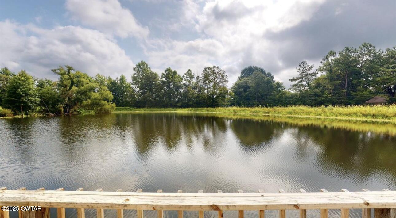 40 J D Barr Road Milan, TN 38358 - Photo 22 of 28 a view of a lake with a house