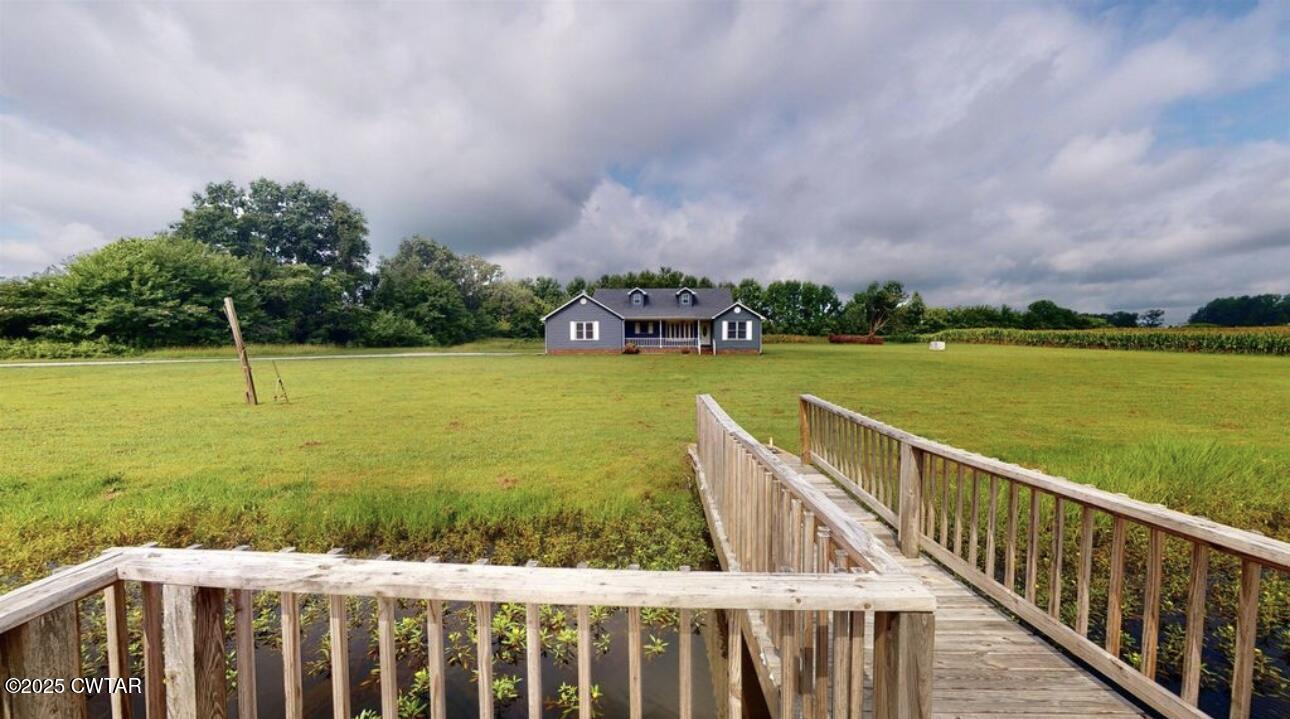 40 J D Barr Road Milan, TN 38358 - Photo 23 of 28 a view of a garden and wooden bridge