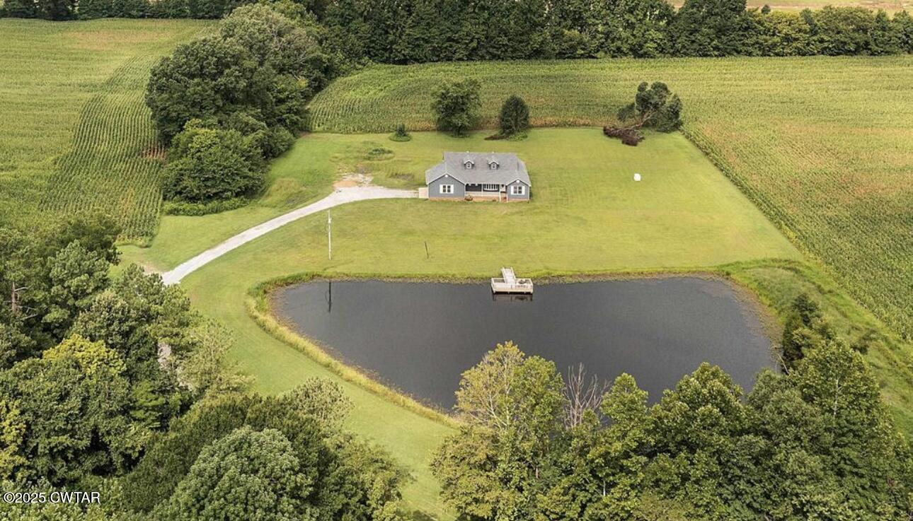 40 J D Barr Road Milan, TN 38358 - Photo 28 of 28 a view of a swimming pool and trees in the background