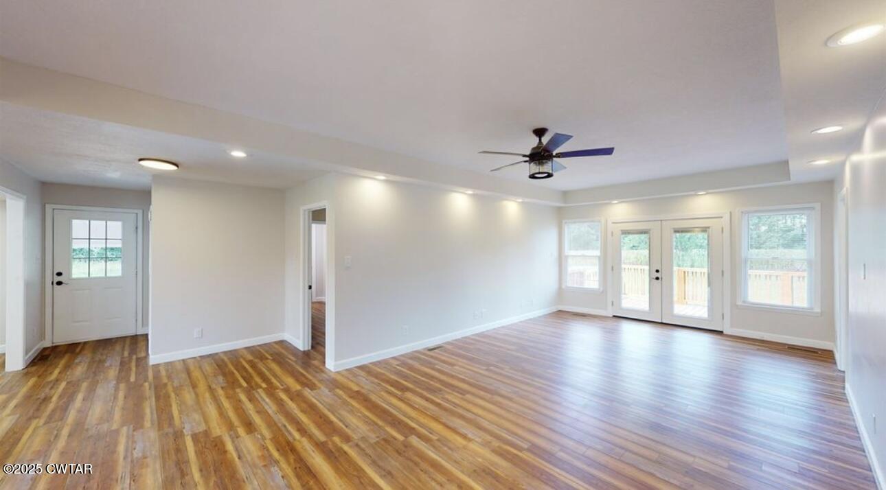 40 J D Barr Road Milan, TN 38358 - Photo 9 of 28 a view of an empty room with wooden floor and a window