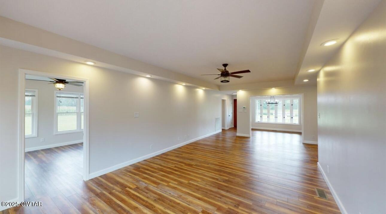 40 J D Barr Road Milan, TN 38358 - Photo 10 of 28 a view of an empty room with window and wooden floor