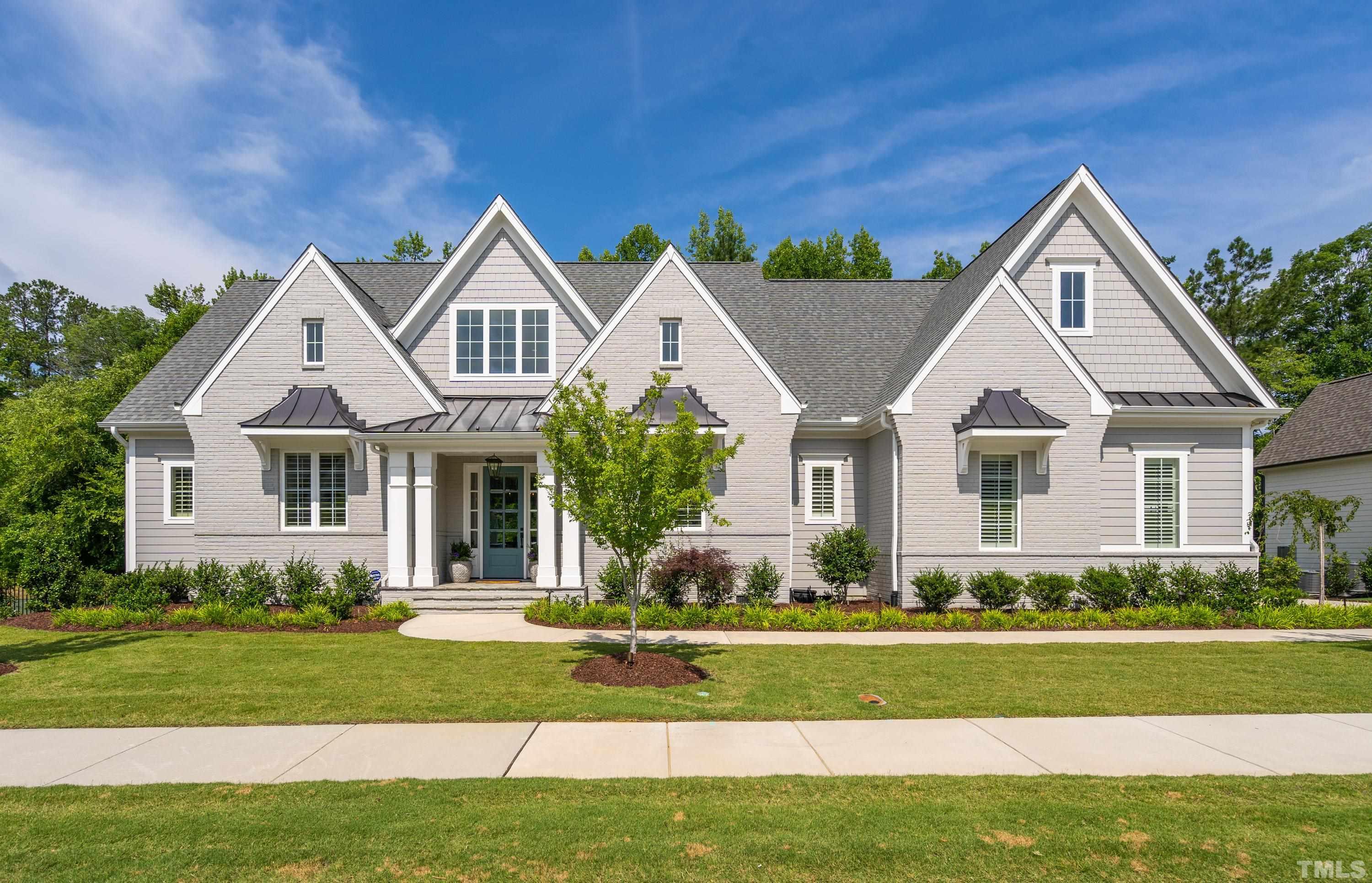 3013 Colmar Manor Drive Cary, NC 27519 - Photo 1 of 53 a front view of a house with a yard