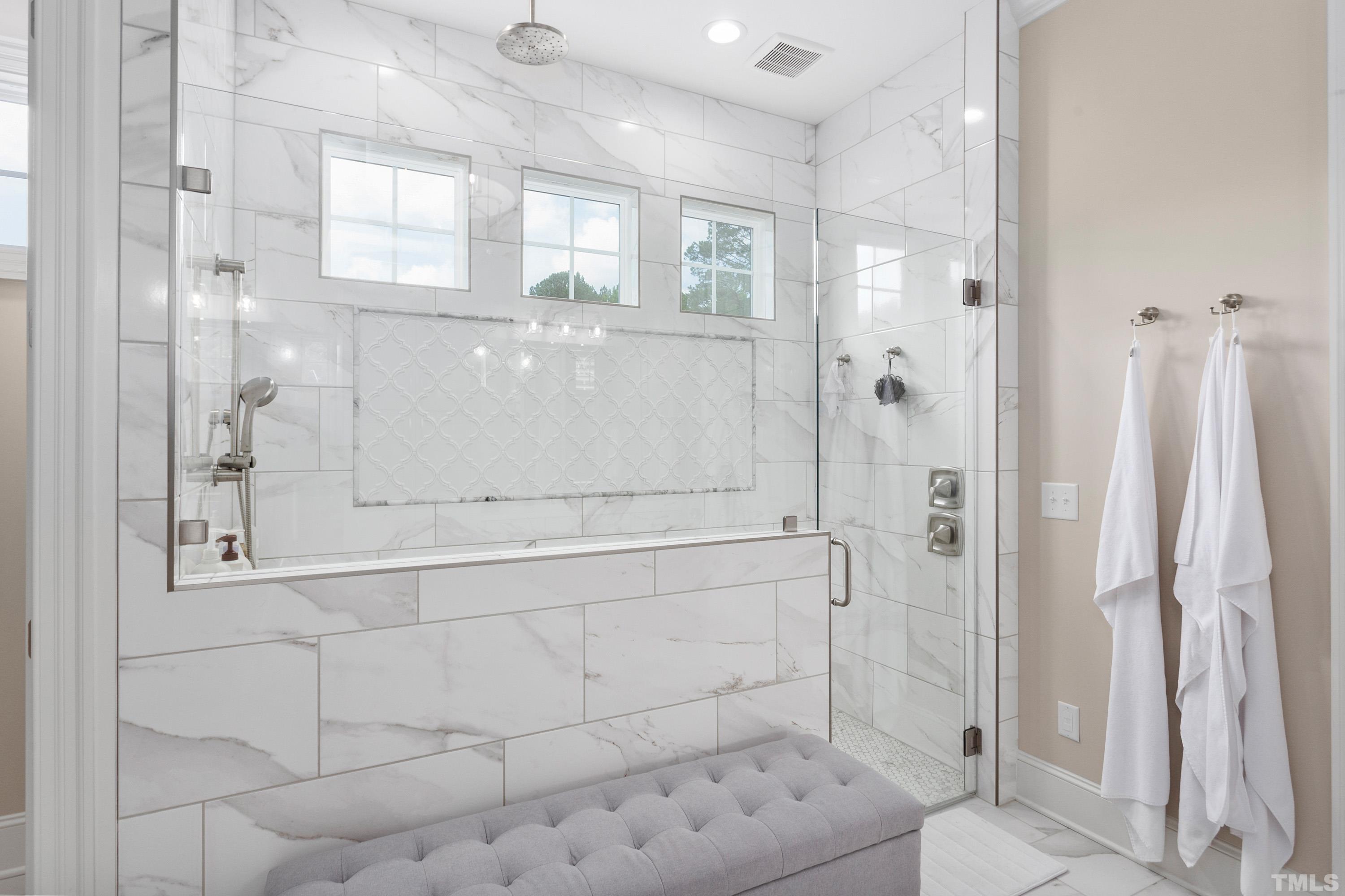 3013 Colmar Manor Drive Cary, NC 27519 - Photo 17 of 53 a bathroom with a glass shower door