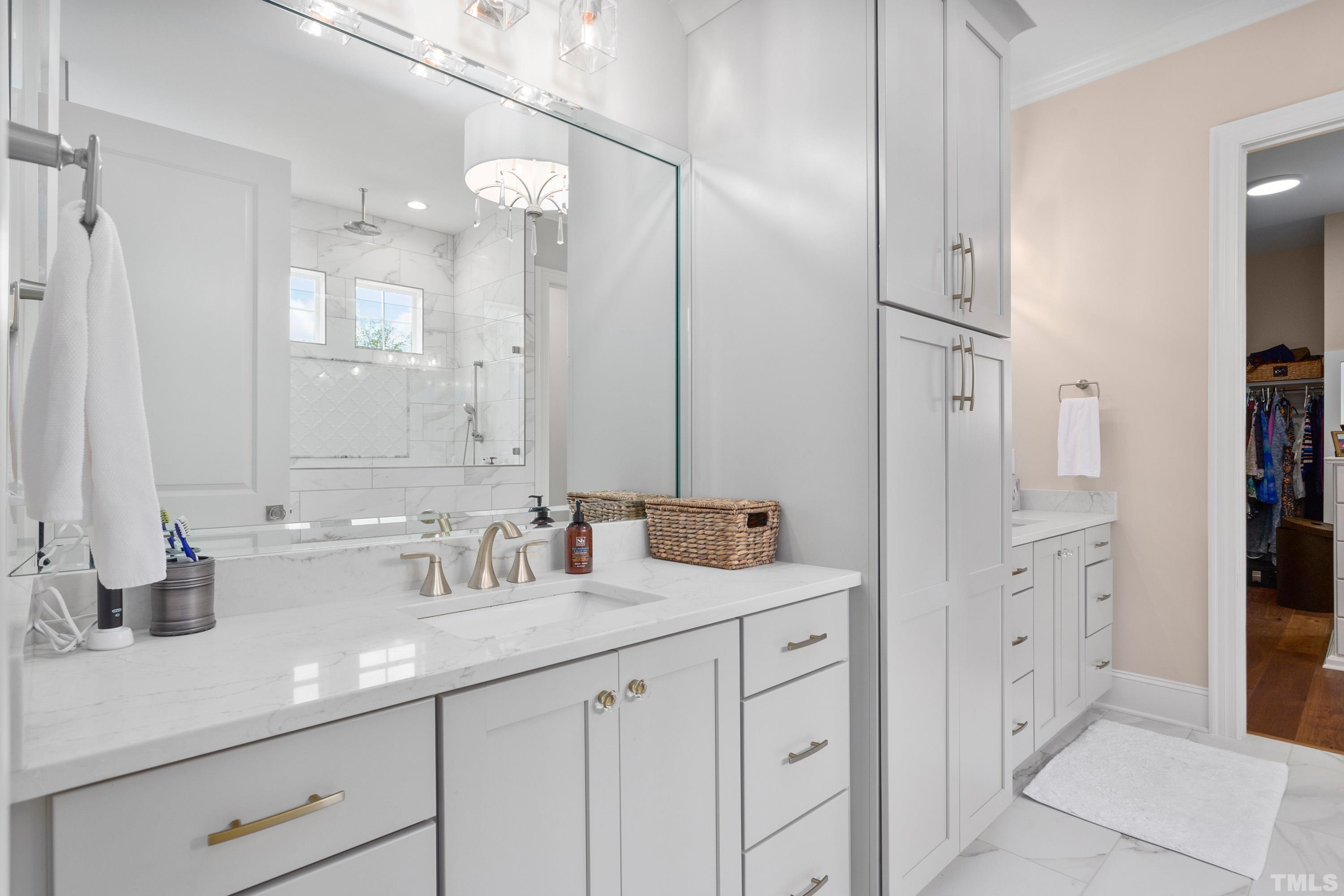 3013 Colmar Manor Drive Cary, NC 27519 - Photo 18 of 53 a bathroom with double sink and a mirror