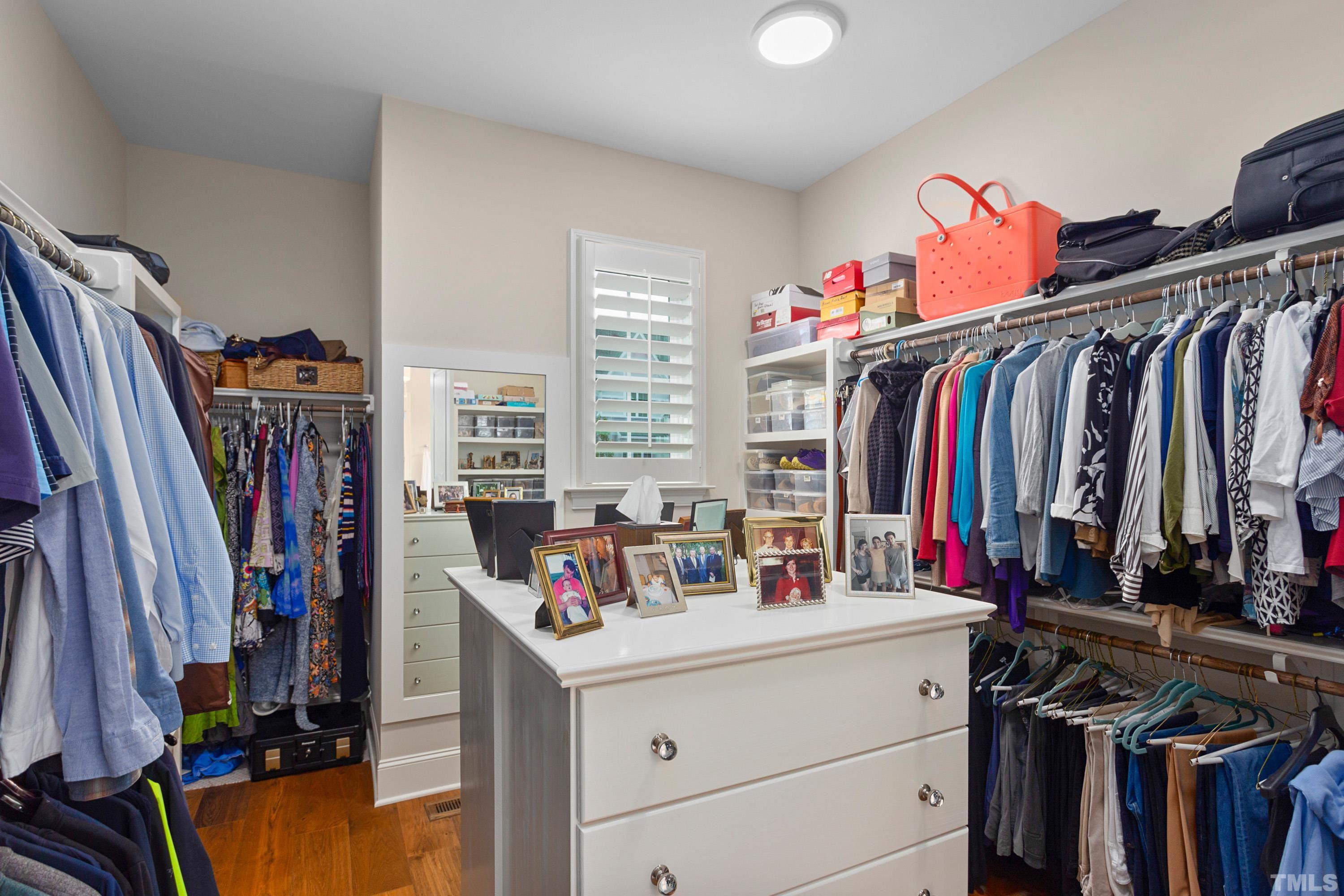 3013 Colmar Manor Drive Cary, NC 27519 - Photo 19 of 53 a view of walk in closet with clothes and shoes
