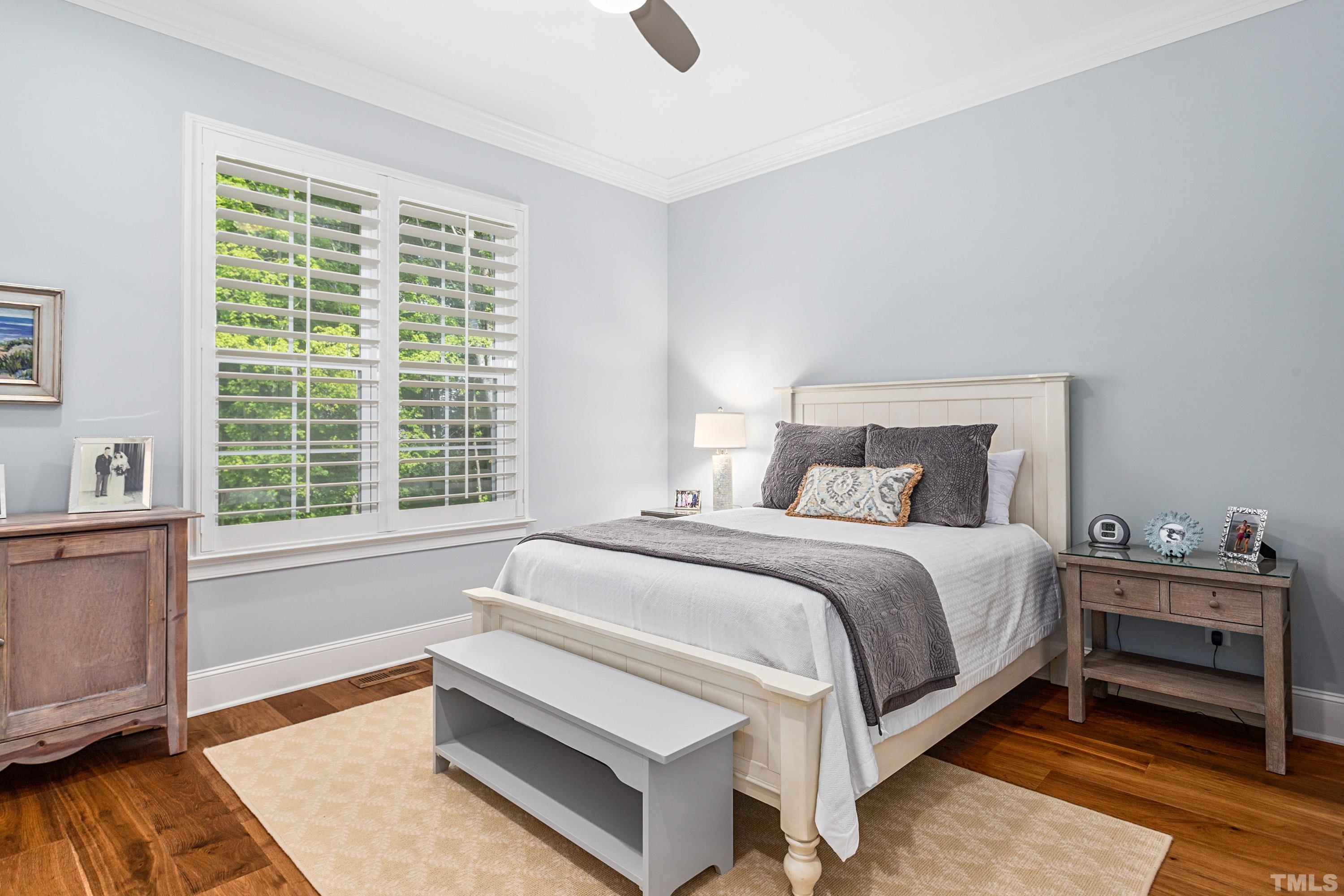 3013 Colmar Manor Drive Cary, NC 27519 - Photo 22 of 53 a bedroom with a bed and windows