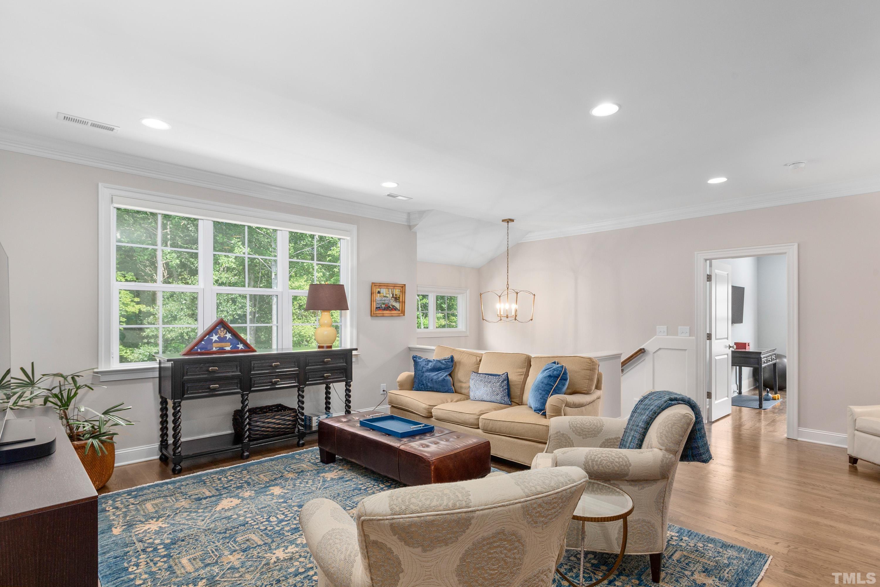 3013 Colmar Manor Drive Cary, NC 27519 - Photo 27 of 53 a living room with furniture and a large window