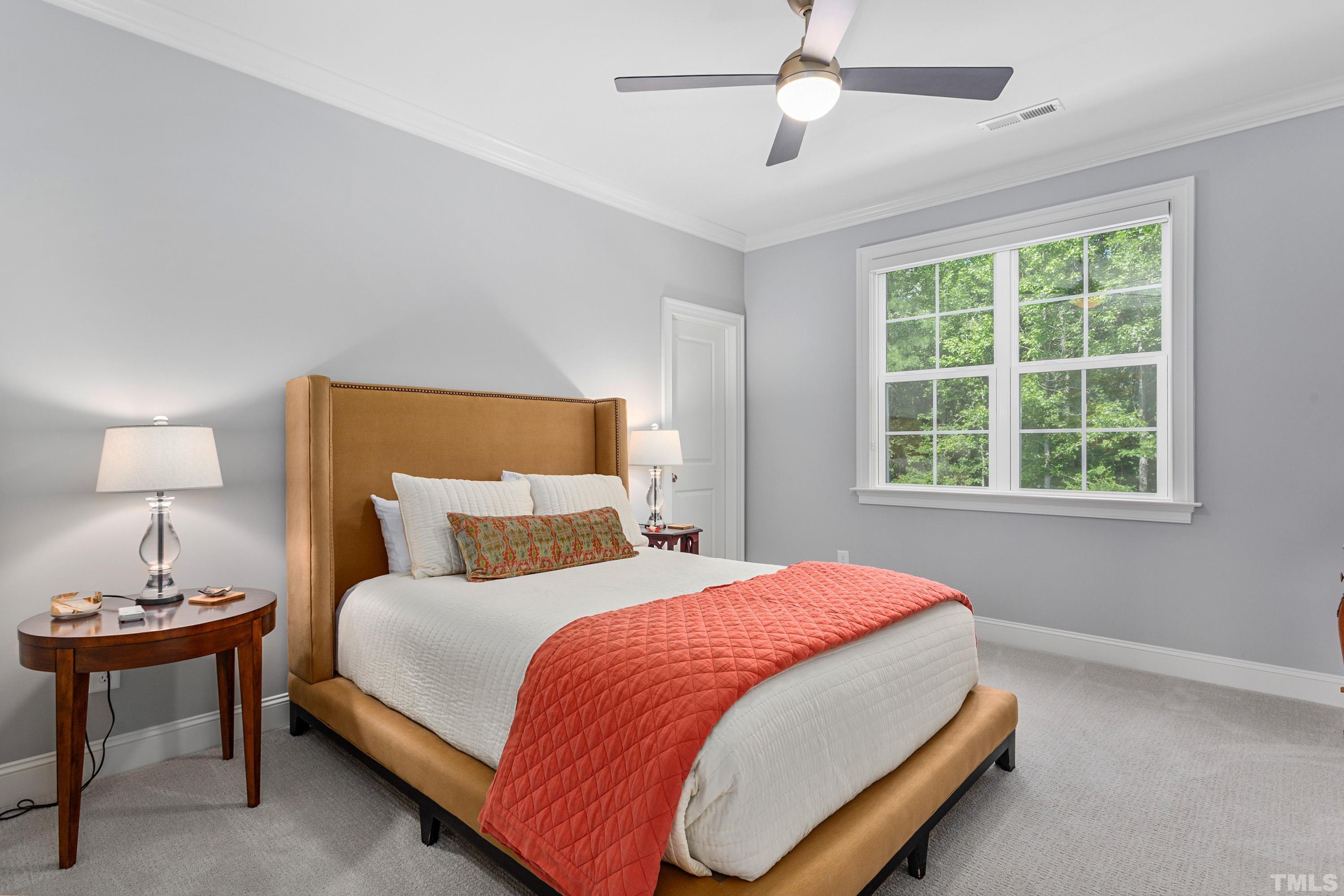 3013 Colmar Manor Drive Cary, NC 27519 - Photo 35 of 53 a bedroom with a bed and a window