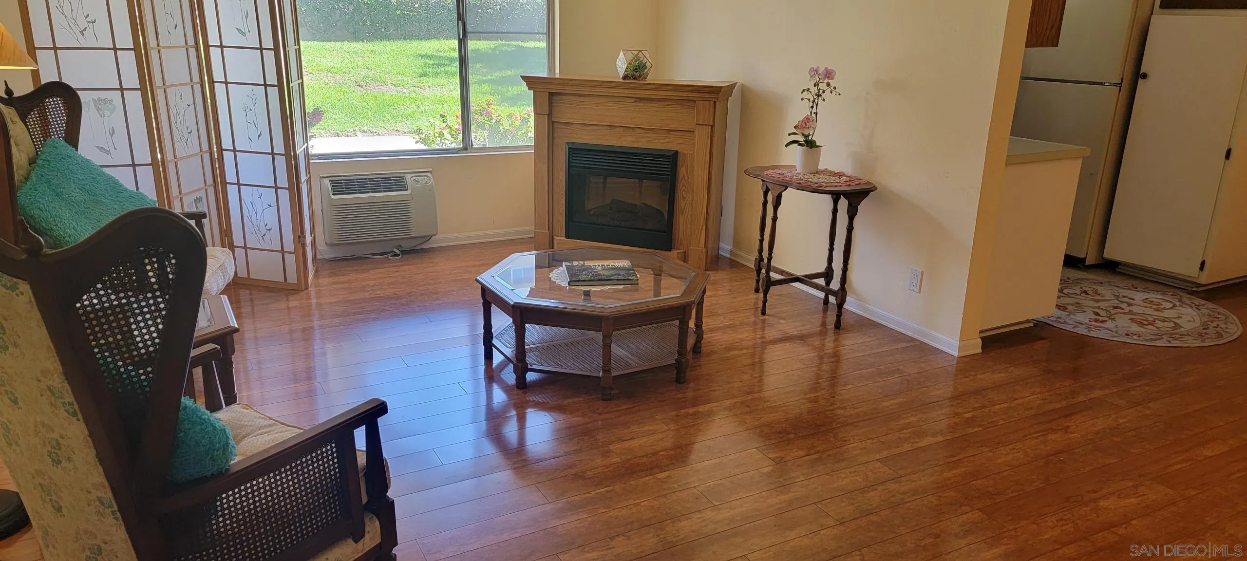 4475 Dale Avenue, Unit 102 La Mesa, CA 91941 - Photo 1 of 1 a living room with furniture and a fireplace