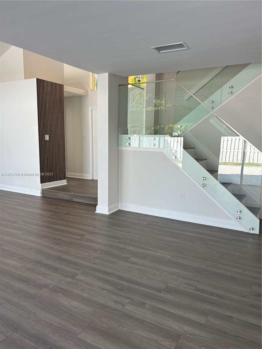 Three Lakes Miami, FL 33186 - Photo 1 of 32 a view of a hallway with wooden floor