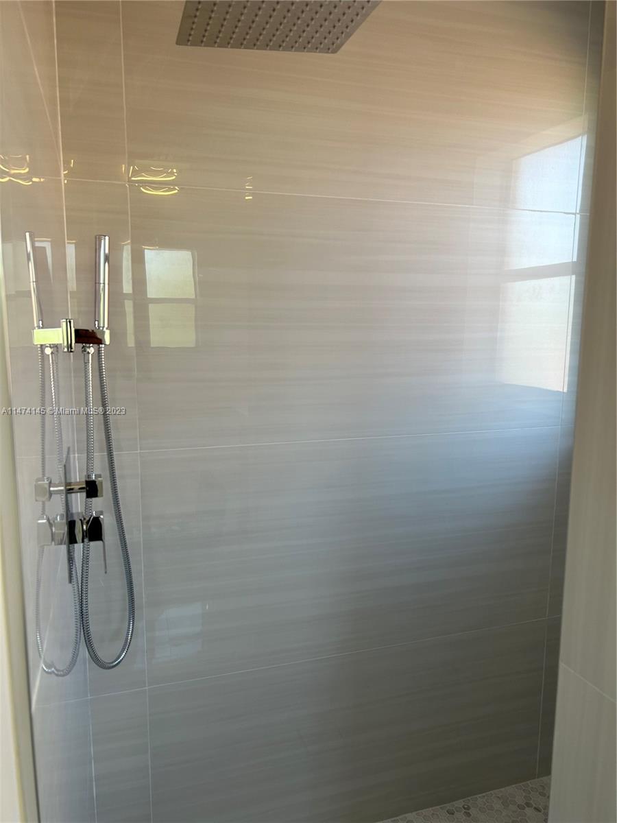 Three Lakes Miami, FL 33186 - Photo 17 of 32 a bathroom with a shower