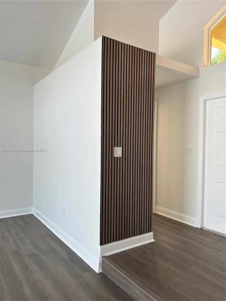 Three Lakes Miami, FL 33186 - Photo 21 of 32 an empty room with wooden floor