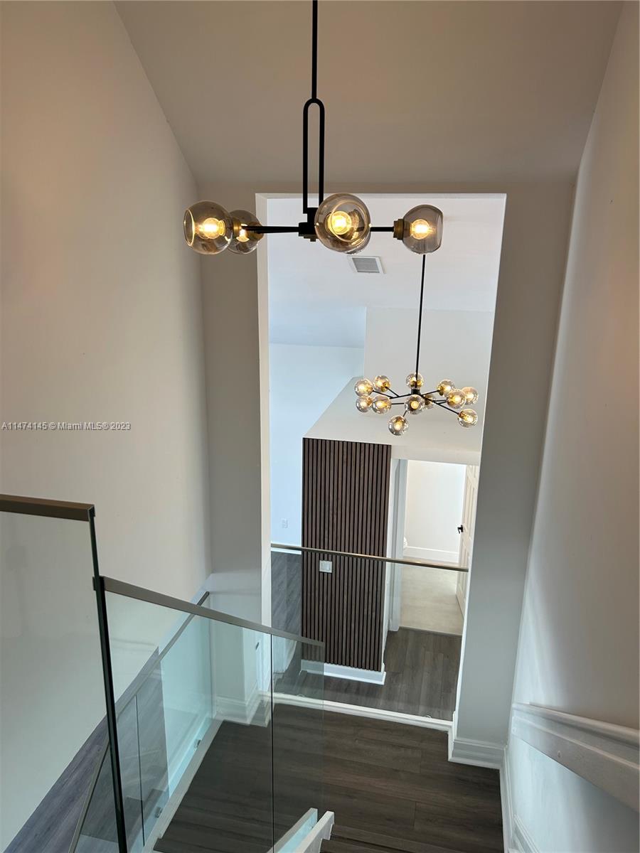 Three Lakes Miami, FL 33186 - Photo 5 of 32 a view of entryway and hall with wooden floor