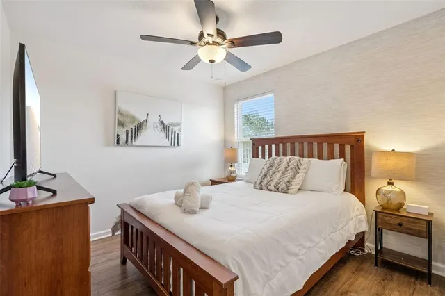 a bedroom with a bed and chandelier