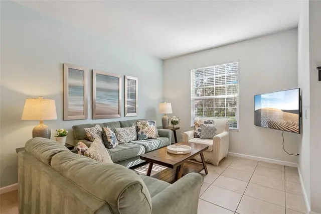 a living room with furniture and a window