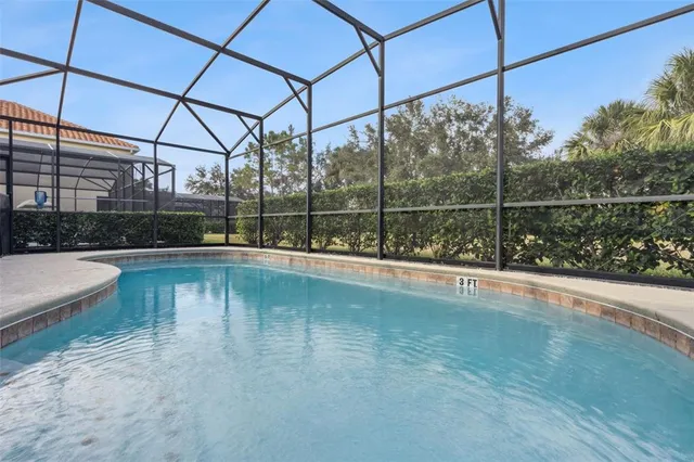 an aerial view of residential houses with outdoor space and river
