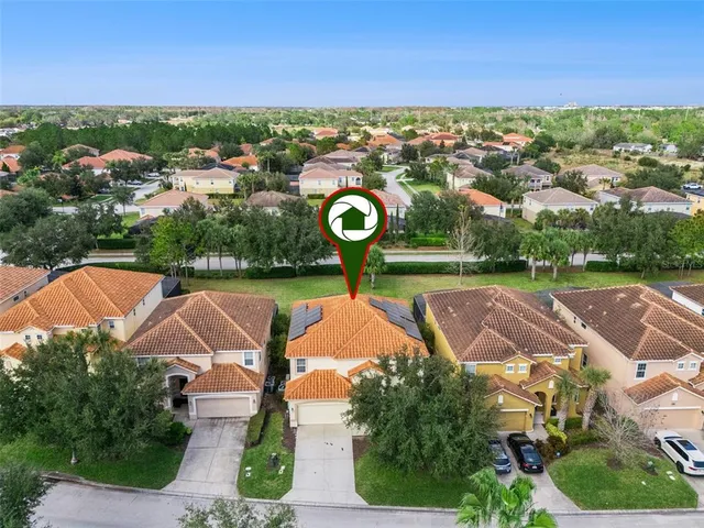 an aerial view of residential houses with outdoor space