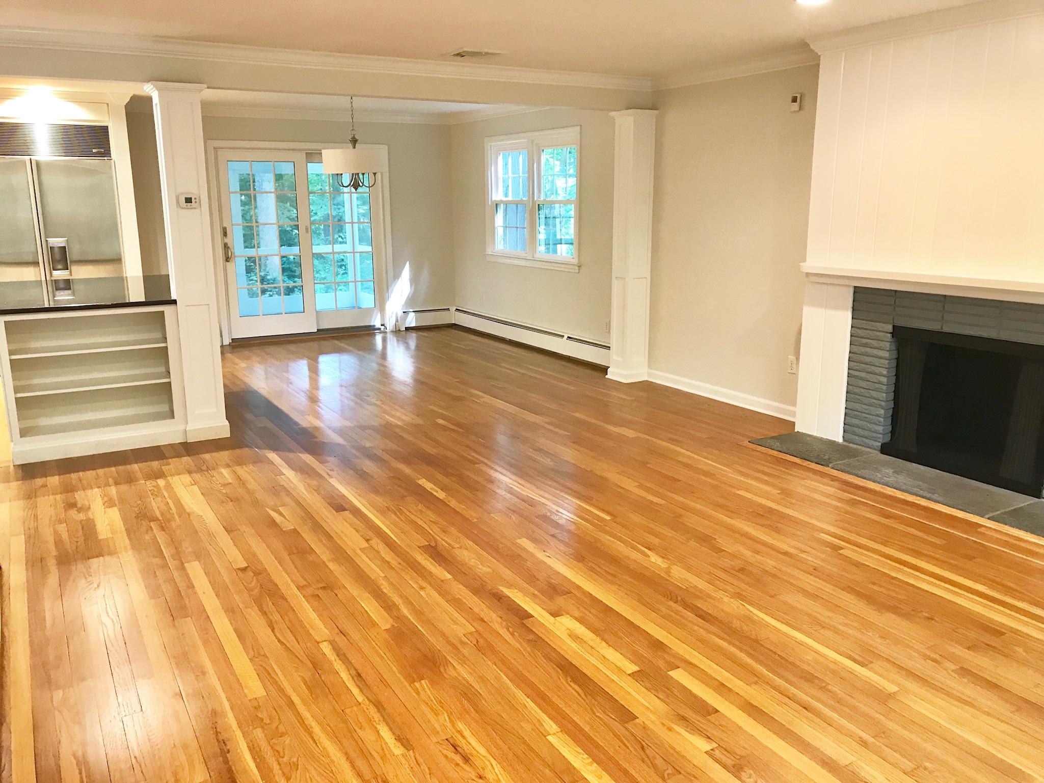 191 Laurel Road New Canaan, CT 06840 - Photo 11 of 39 a view of an empty room with wooden floor and a window