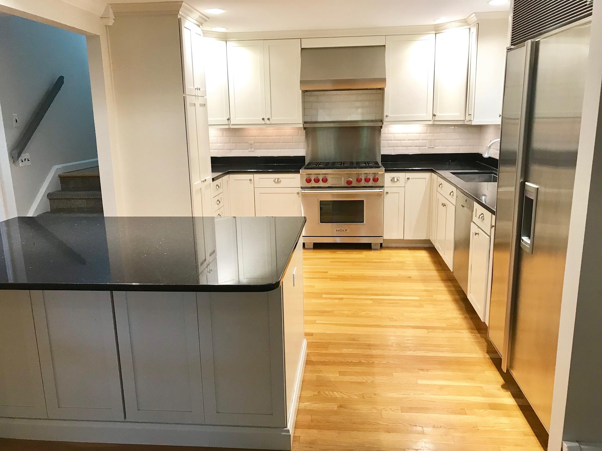 191 Laurel Road New Canaan, CT 06840 - Photo 14 of 39 a kitchen with stainless steel appliances granite countertop a refrigerator a stove and a sink