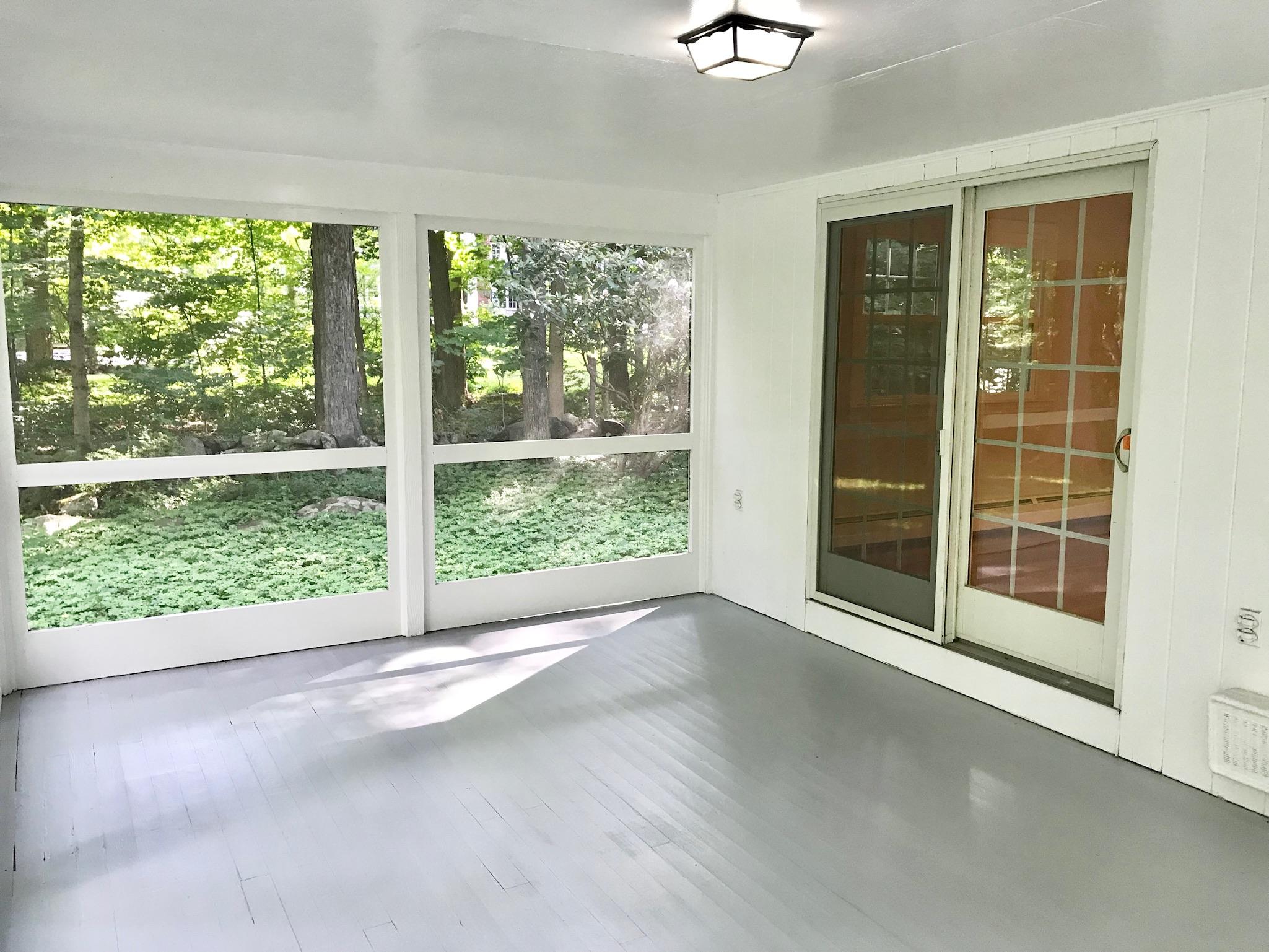 191 Laurel Road New Canaan, CT 06840 - Photo 17 of 39 a view of an empty room with a large window