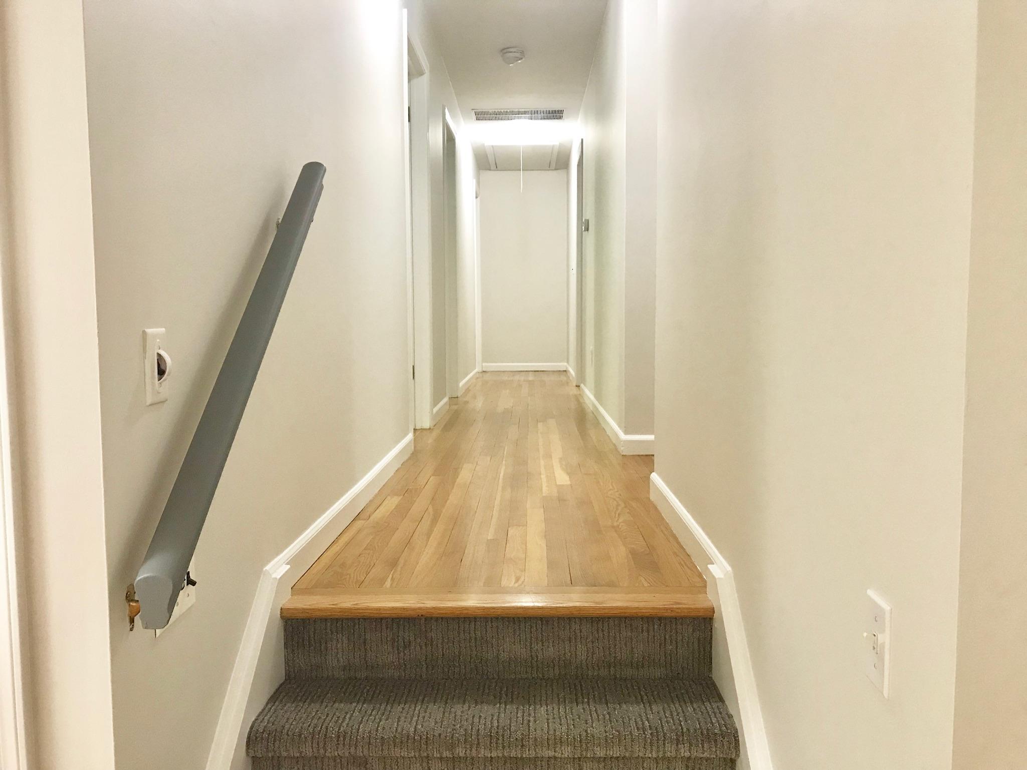 191 Laurel Road New Canaan, CT 06840 - Photo 18 of 39 a view of staircase with white walls