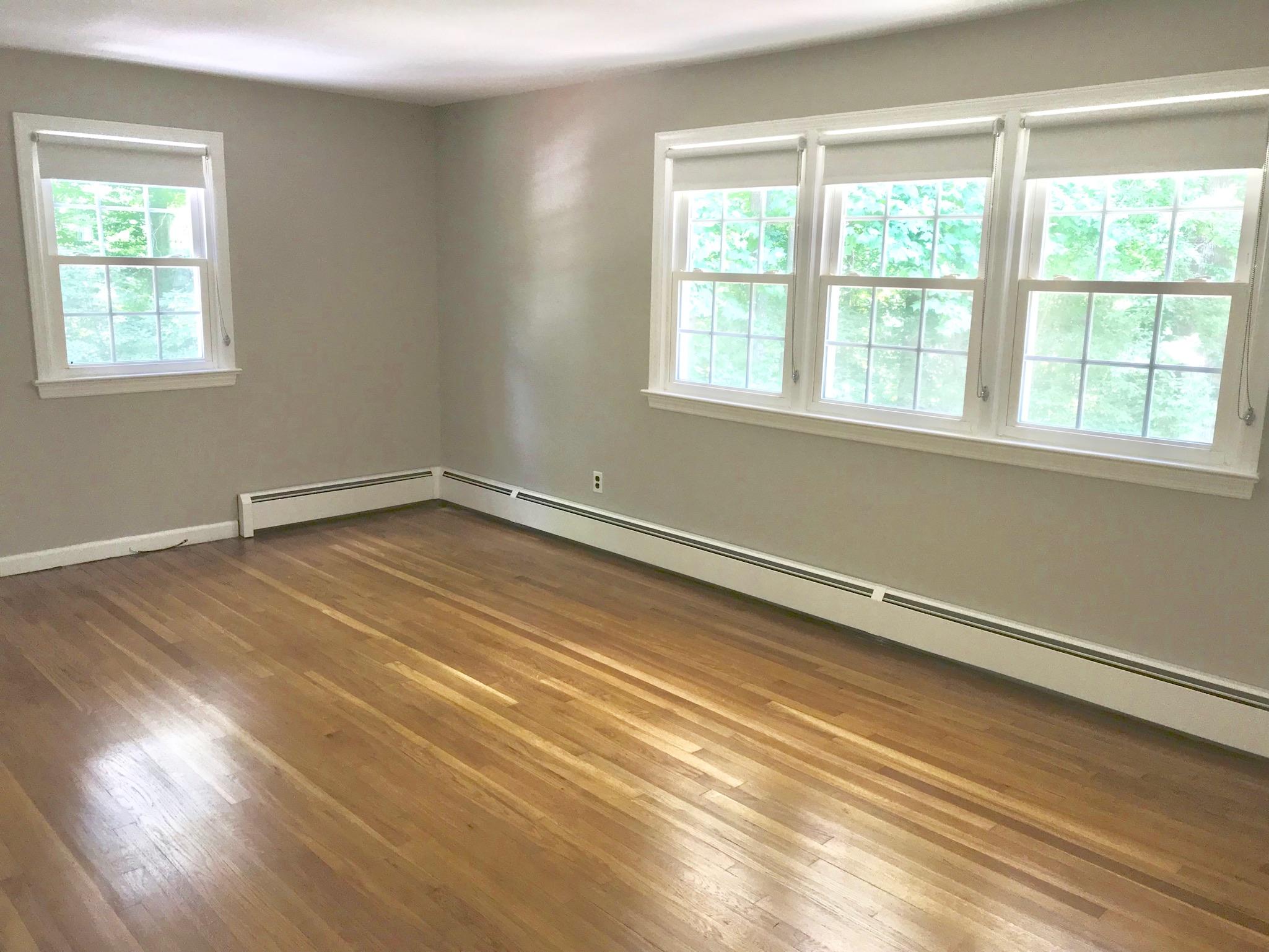 191 Laurel Road New Canaan, CT 06840 - Photo 19 of 39 wooden floor and windows in a room