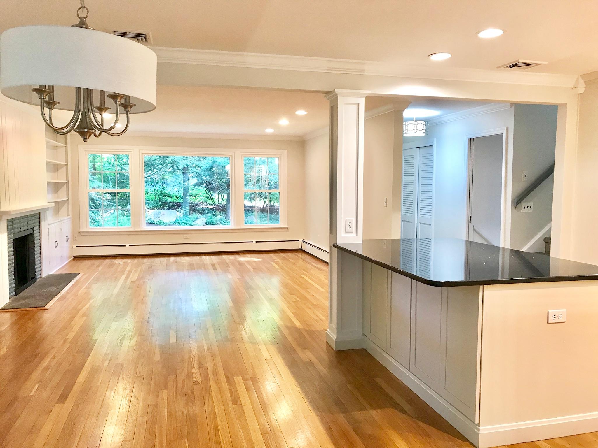 191 Laurel Road New Canaan, CT 06840 - Photo 7 of 39 a view of an entryway with wooden floor and a fire pit