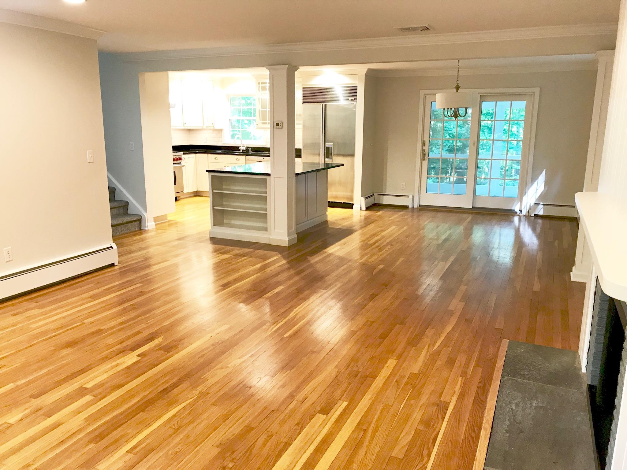 191 Laurel Road New Canaan, CT 06840 - Photo 10 of 39 a view of an empty room with wooden floor and a window