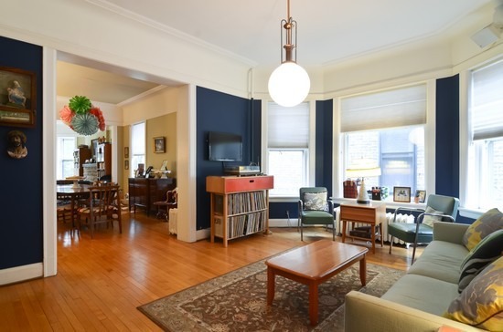 Undisclosed Address Chicago, IL 60647 - Photo 12 of 25 a living room with furniture kitchen view and large windows