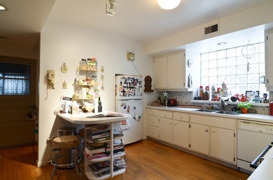 Undisclosed Address Chicago, IL 60647 - Photo 13 of 25 a kitchen with a sink stove and cabinets