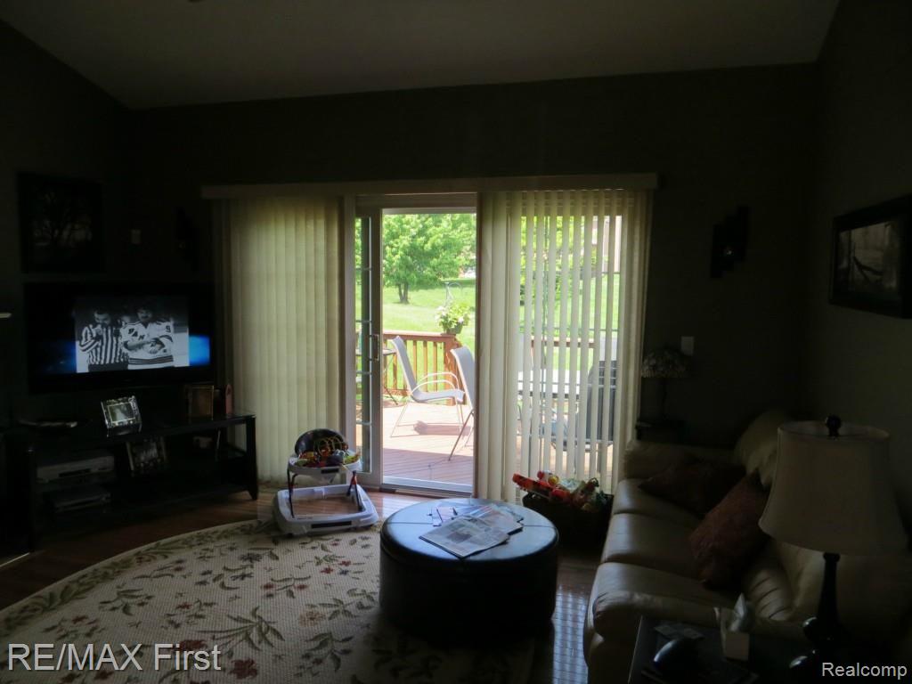 1341 Copper Circle, Unit 33 Rochester, MI 48306 - Photo 13 of 37 Great room doorwall to deck